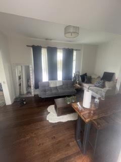 dining space featuring dark wood-type flooring