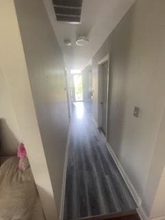 hallway with dark hardwood / wood-style floors