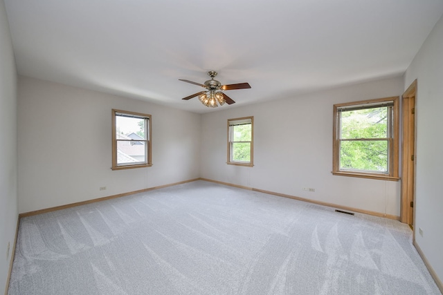 1553 Marquette Ave, Naperville, IL 60565 - spare room featuring light colored carpet, baseboards, and ceiling fan