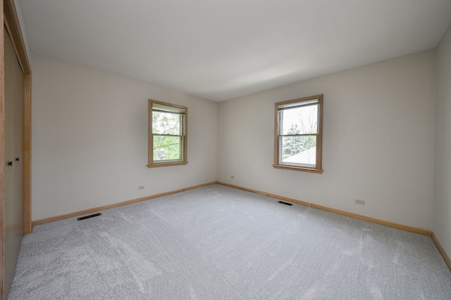 1553 Marquette Ave, Naperville, IL 60565 - spare room with baseboards and light colored carpet