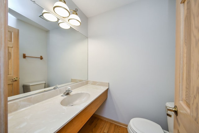 1553 Marquette Ave, Naperville, IL 60565 - bathroom featuring toilet, wood finished floors, vanity, and baseboards