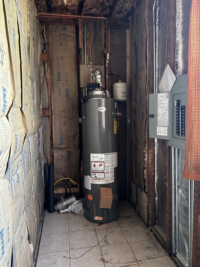 utility room featuring water heater