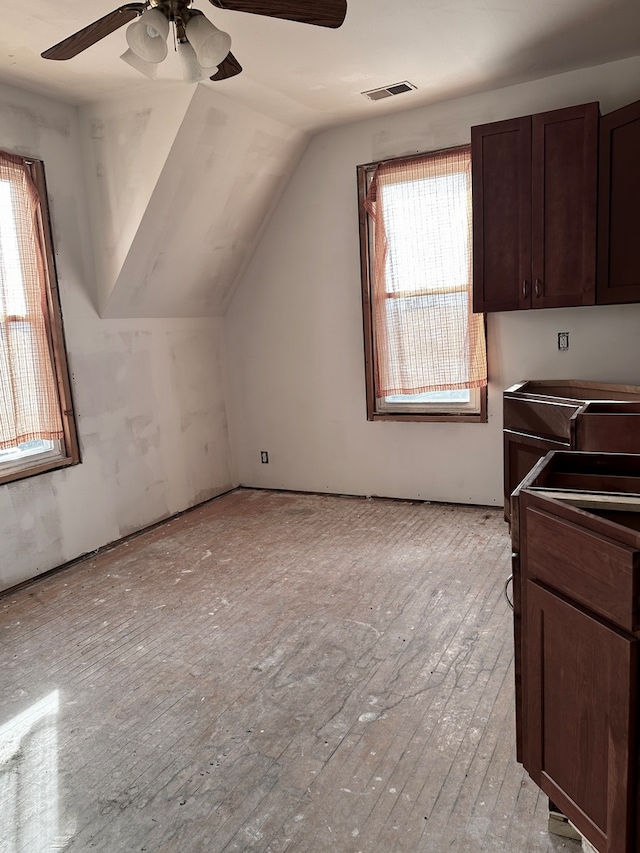 bonus room with ceiling fan, vaulted ceiling, and light hardwood / wood-style flooring