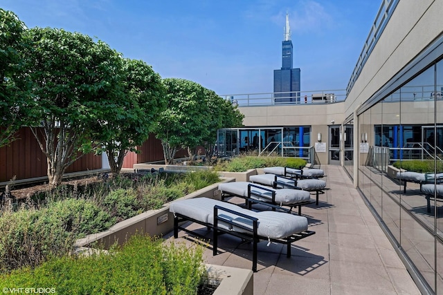 view of home's community with a patio area