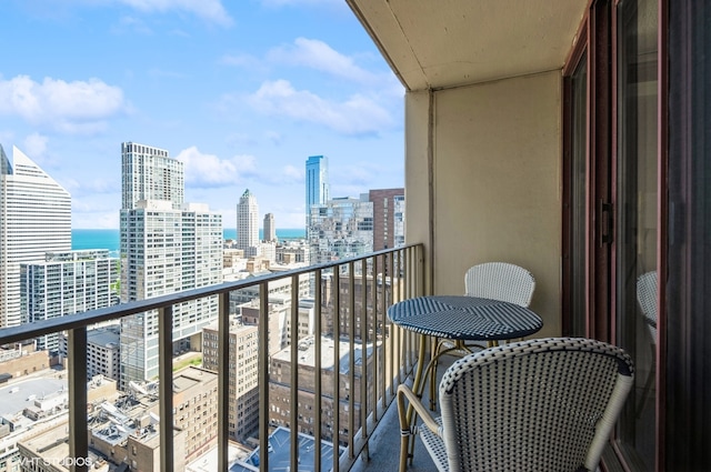 balcony featuring a water view