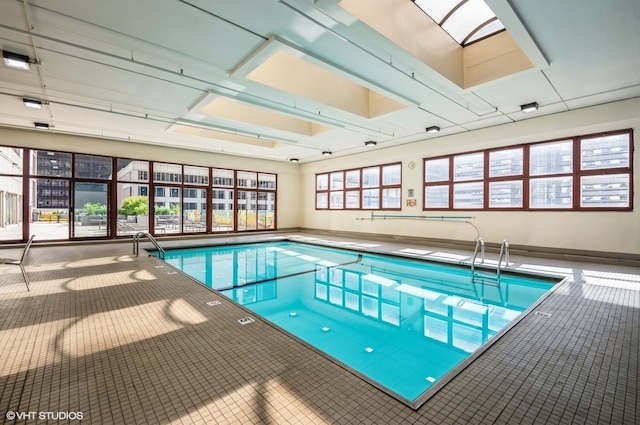 view of pool with a skylight