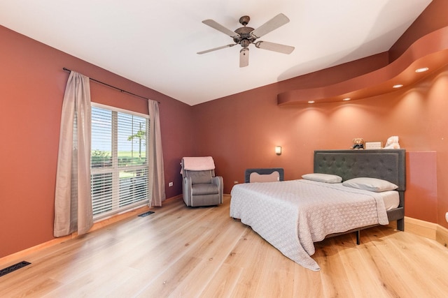 bedroom featuring ceiling fan and light hardwood / wood-style flooring