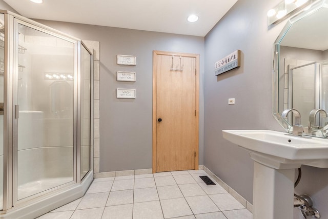 bathroom featuring tile patterned floors and an enclosed shower