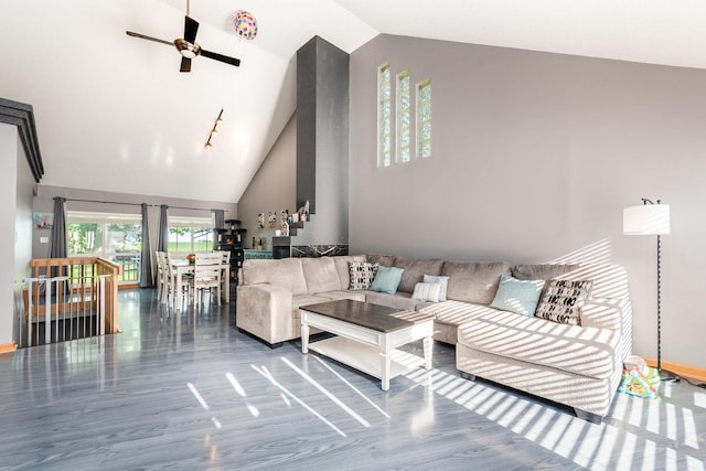 living room with high vaulted ceiling and ceiling fan