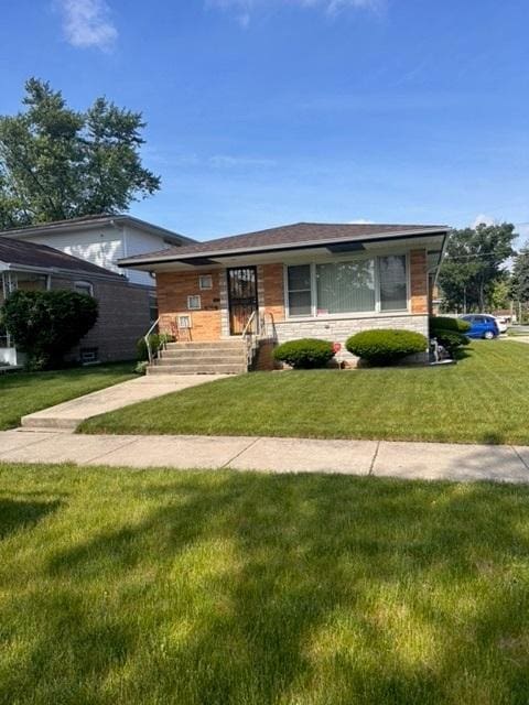 ranch-style house with a front lawn