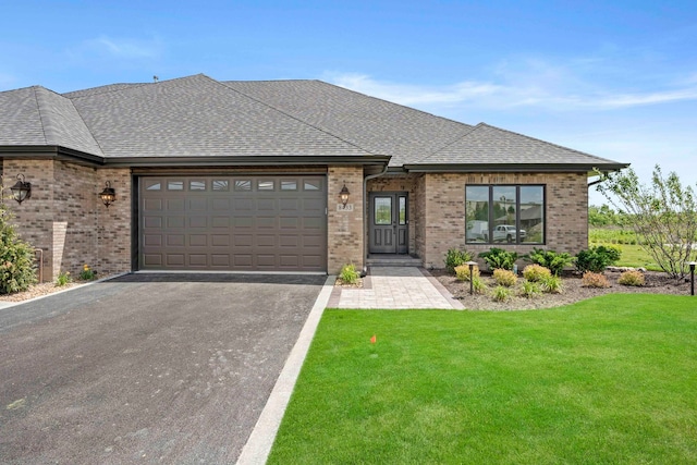 view of front facade with a garage and a front yard