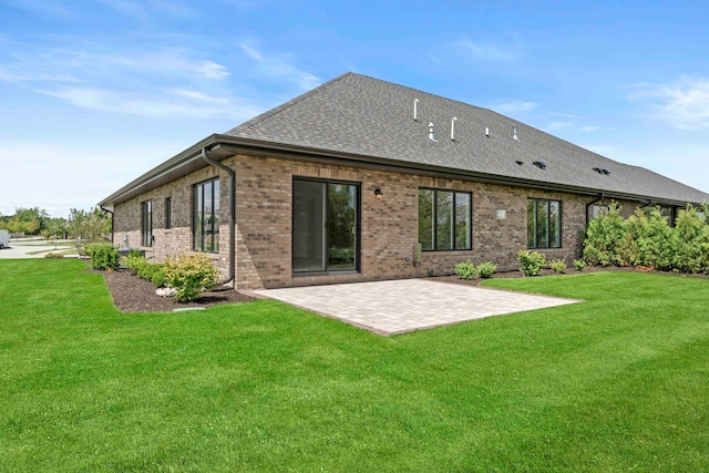 back of house featuring a yard and a patio area