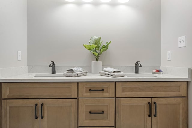 bathroom with double vanity and a sink