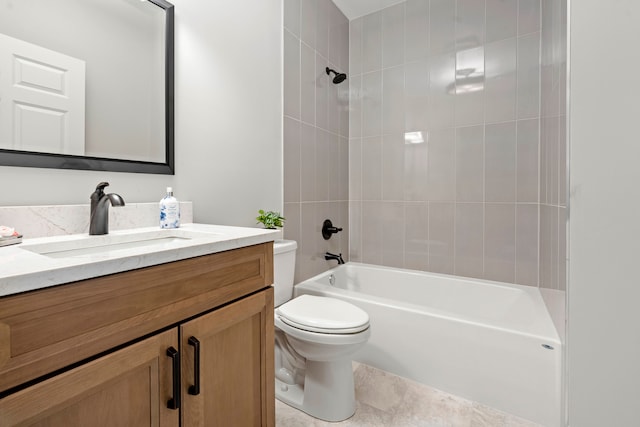 full bathroom featuring tile flooring, tiled shower / bath combo, vanity, and toilet