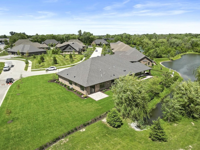 bird's eye view featuring a residential view and a water view