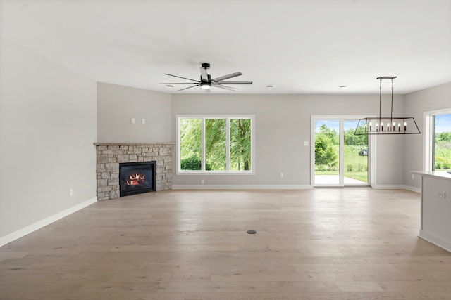 unfurnished living room with plenty of natural light and light hardwood / wood-style floors