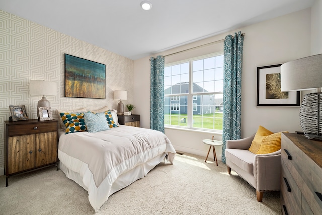 bedroom with light colored carpet