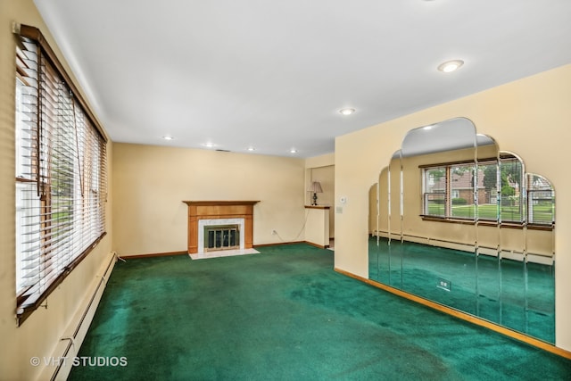 unfurnished living room featuring baseboard heating, a fireplace, and carpet