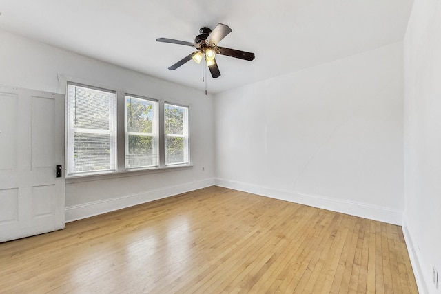 spare room with light hardwood / wood-style floors and ceiling fan