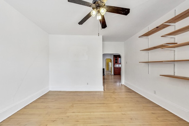 unfurnished room with ceiling fan and light wood-type flooring