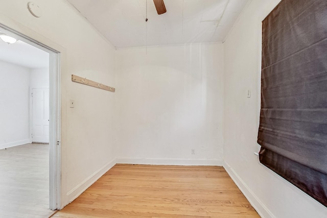 empty room featuring ceiling fan and light hardwood / wood-style floors