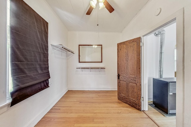 spacious closet with ceiling fan and light hardwood / wood-style floors