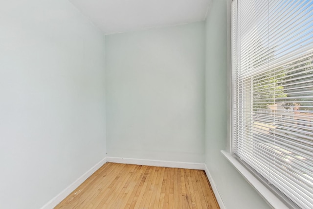 unfurnished room with light wood-type flooring