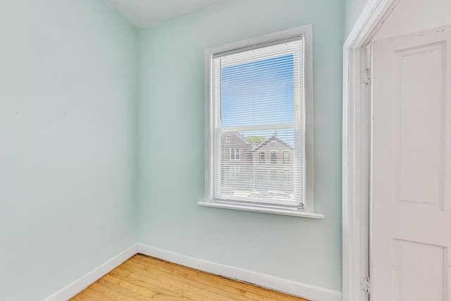 unfurnished room with hardwood / wood-style floors