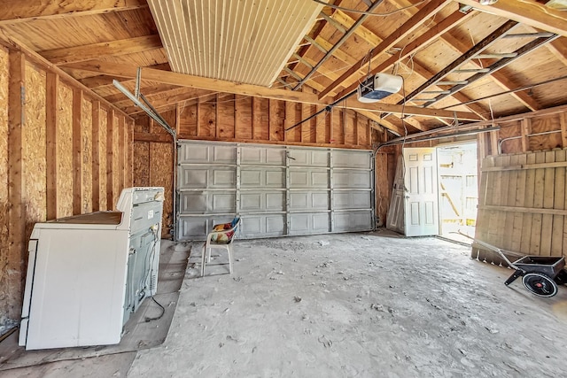 garage featuring washer / clothes dryer and a garage door opener