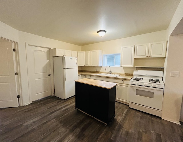 kitchen featuring a center island, dark hardwood / wood-style flooring, white appliances, and sink