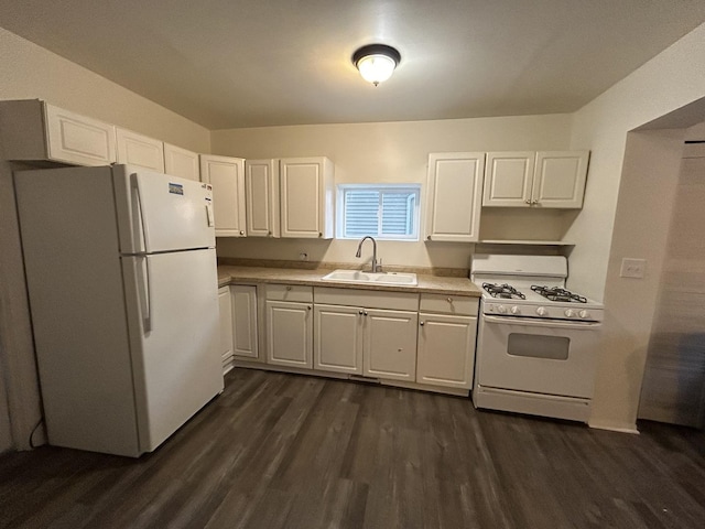 kitchen with white cabinets, white appliances, dark wood-type flooring, and sink