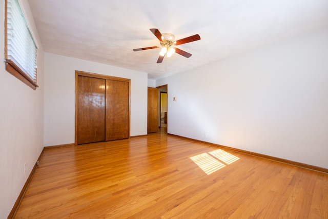 unfurnished bedroom featuring ceiling fan and light wood-type flooring