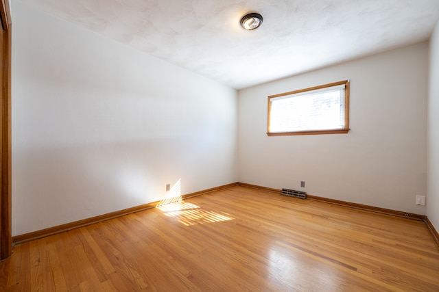 spare room with light wood-type flooring