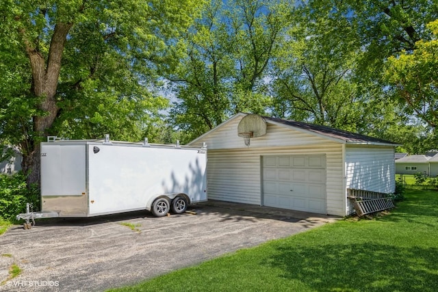 garage featuring a yard