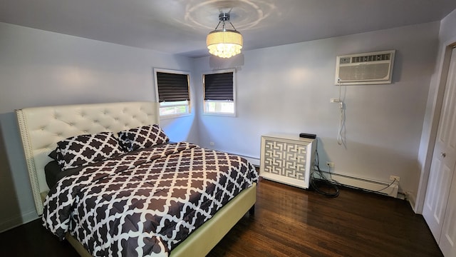 bedroom with dark wood-type flooring, baseboard heating, a chandelier, and a wall mounted AC