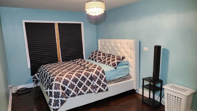 824 N Austin Blvd Unit 3E, Oak Park, IL 60302 - bedroom featuring wood finished floors, baseboards, and a chandelier