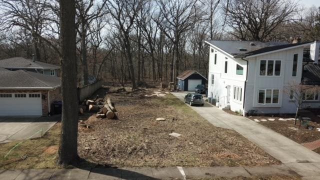 view of side of home with a garage