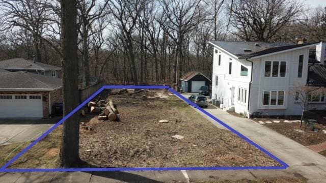 view of yard featuring a garage