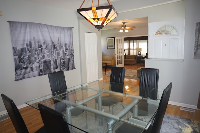 dining room featuring hardwood / wood-style floors and ceiling fan