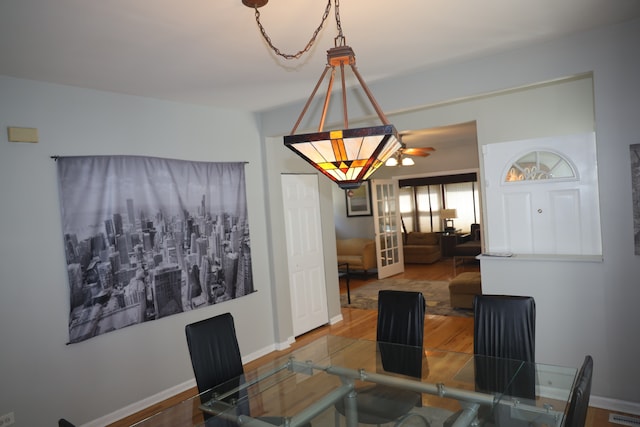 dining area featuring ceiling fan and hardwood / wood-style flooring