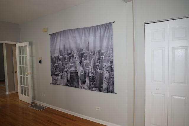 interior space with a closet and hardwood / wood-style flooring