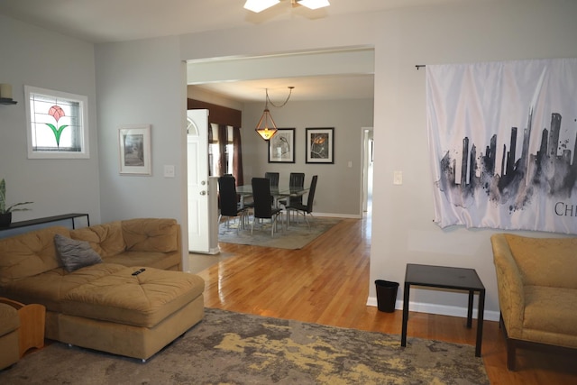 1040 N Austin Blvd, Oak Park, IL 60302 - living area with wood finished floors, a healthy amount of sunlight, and baseboards