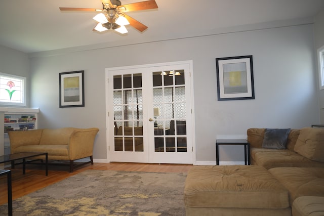 living room featuring french doors, ceiling fan, and hardwood / wood-style floors