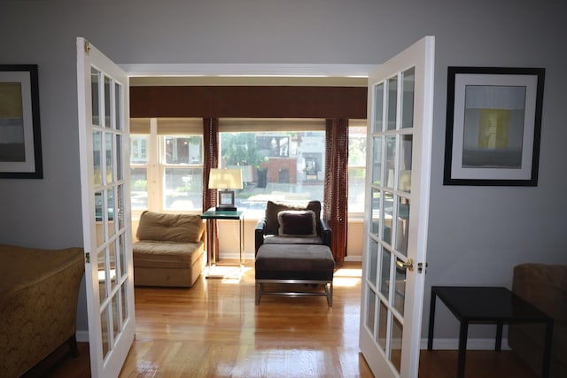 1040 N Austin Blvd, Oak Park, IL 60302 - living area with wood finished floors, baseboards, and french doors