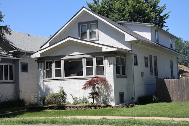 1040 N Austin Blvd, Oak Park, IL 60302 - bungalow-style home with fence, a front yard, and stucco siding