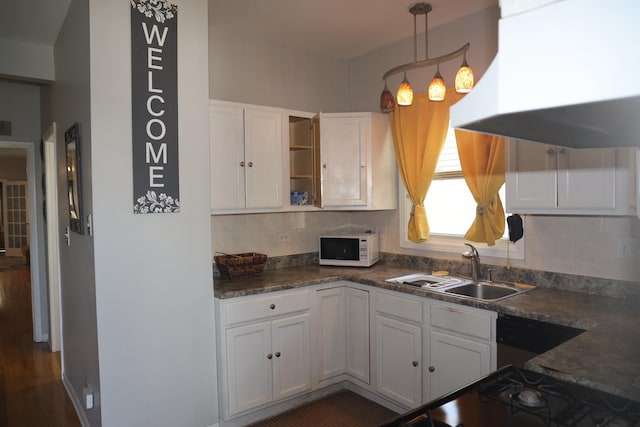 1040 N Austin Blvd, Oak Park, IL 60302 - kitchen with range hood, open shelves, a sink, white microwave, and white cabinetry