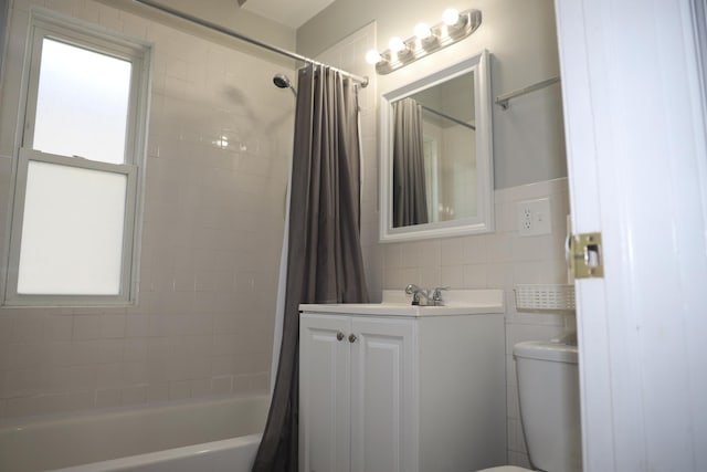 1040 N Austin Blvd, Oak Park, IL 60302 - bathroom with tile walls, shower / bath combo with shower curtain, vanity, and toilet