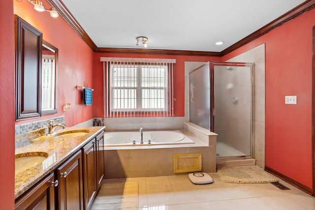 bathroom with tile patterned flooring, crown molding, independent shower and bath, and vanity