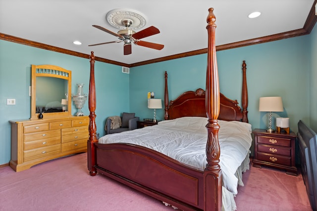 bedroom featuring ceiling fan, crown molding, and carpet