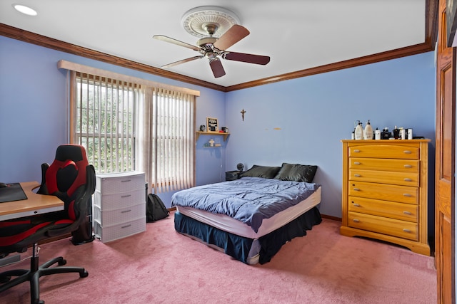 carpeted bedroom with ceiling fan and ornamental molding